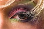 eye women beautiful green color on the background of blond hair