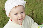 Cute infant girl with knit white hat