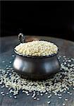 Close up of sesame seeds on a wood table