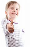 little girl showing thumb up on white