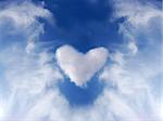 Abstract heart in blue sky.