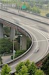 Interchange in highway with cars motion blurred in daytime in Taipei, Taiwan, Asia.