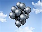 silver air balloons floating on a blue sky