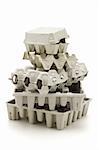 Stack of paper cartons for recycling on white background