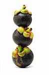 Stack of fresh mangosteens on white background