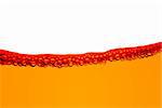 Orange fuel line with bubbles isolated on a white background.