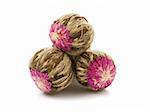 Chinese blooming flower green tea balls on white background
