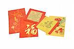 Assorted colorful Chinese New Year red packets on white background