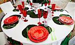 A table setup with Italian flag colours: gree, white and red