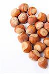 hazelnuts lined with a heart on a white background