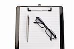 Note pad, pen and glasses on a white background