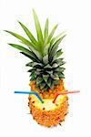 ripe pineapple cut on top with red and blue straws isolated on white background