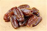 Delicious fresh organic dates on wooden table