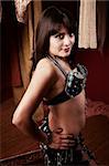 Sensual Mexican American Belly Dancer with hands on hips