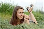 Young girl on the grass.casual style.soft make-up.