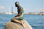 A sculpture of Little Mermaid in the harbour of Copenhagen