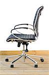modern black leather office chair on wood floor over white background