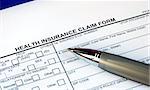 Filling the health insurance claim form isolated in blue