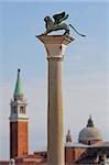 Column with lion-symbol of Venice in front of San Giorgio Maggiore church in Venice, Italy.