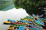 Colorful tour boats at the lakeside of the Fewa Lake, Nepal
