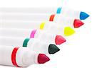 Six colorful markers over white background