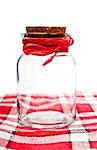 empty jar isolated on a  red tablecloth