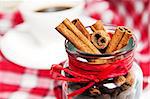 cinnamon  in the pot on a red tablecloth