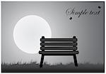 Bench standing on the grass under a full moon and a place for inscription