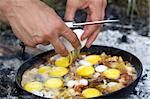 Fried eggs. Cooking on the fire.