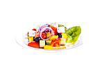 Greek salad on a plate. On a white background.