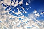 Blue sky with white clouds like background on all frame.