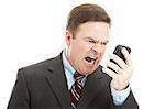 Angry businessman yelling into a cellphone.  Isolated on white.