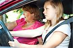 Teenage driver and her mother about to have a car accident.