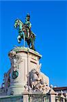 Statue of King Joao I at Figueiroa Square, and St. Jorge castle in Lisbon, Portugal