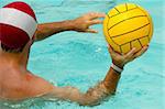 A man is playing water polo