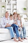 Grandparents with grandchildren at home