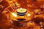 christmas decorative gold material with burning candle