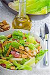 fresh homemade classic ceasar salad ,closeup over a fine embroidery table cover