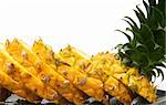 ripe vivid pineapple sliced over white background