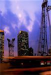 construction cranes on night ove a blue sky