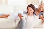 Couple watching the television in their living room