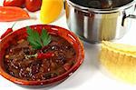 Chili con carne with kidney beans, beef, peppers and parsley
