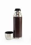 Modern steel thermos with leather armour. Isolated on white with clipping path