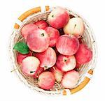 Red mini apples in basket isolated on white background