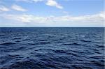 Open blue sea deep water and sky horizon background.