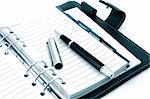 empty business notebook or organizer with pen