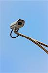 Security camera with blue sky