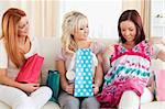 Young cute Women with shopping bags in a living room