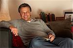 Man Relaxing With Remote Control