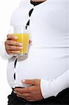 Pregnant woman holding a glass of orange juice , isolated on white background